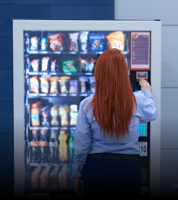 Person using a vending machine.